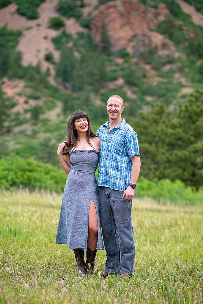 A couple standing in the field.