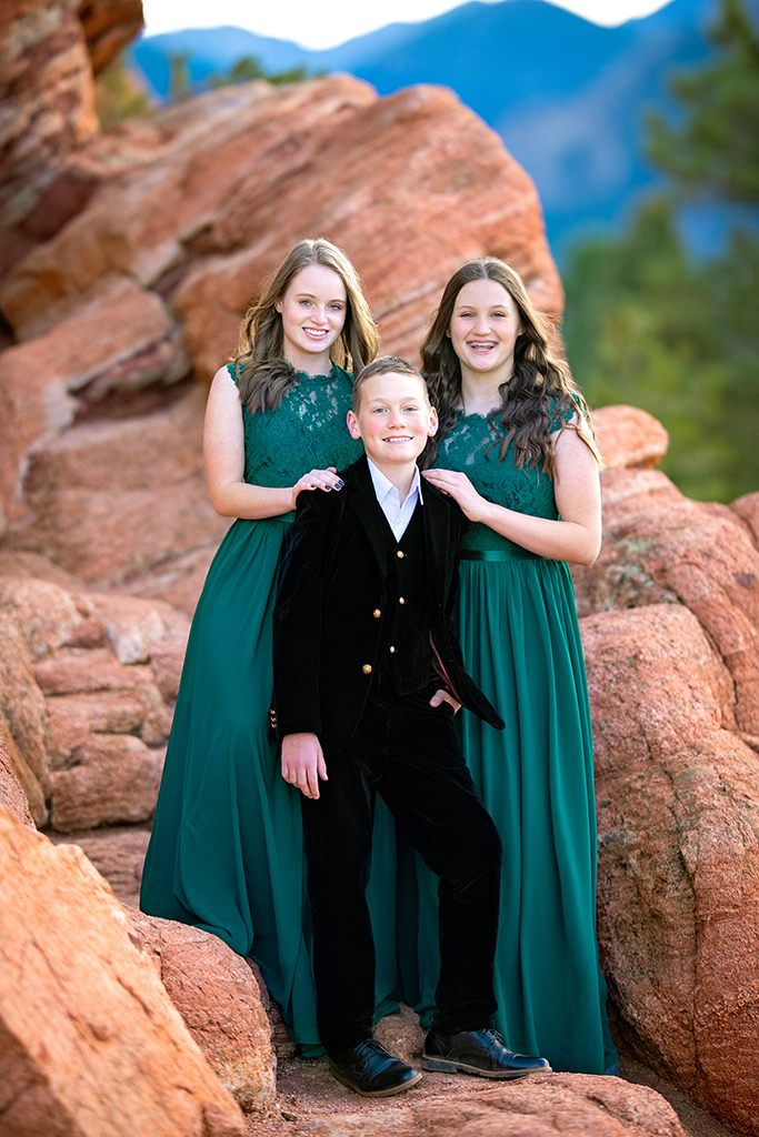 Three siblings elegantly dressed at the Garden of the Gods.