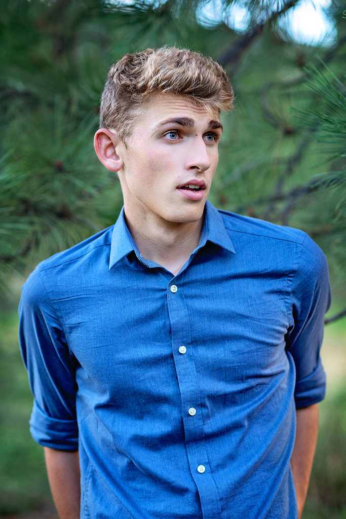 A young man wearing a blue shirt.