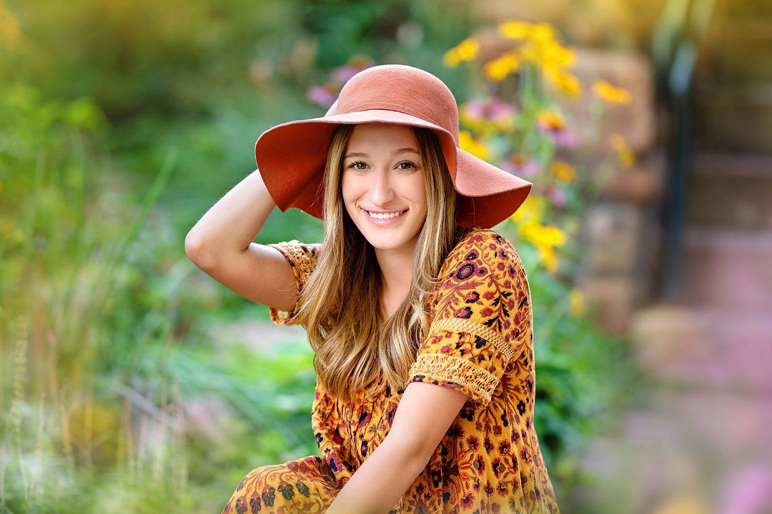 A young lady wearing a brown hat.